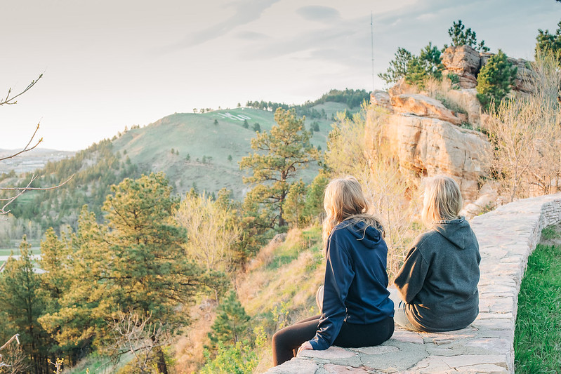 Students hiking in Rapid City with M Hill in distance