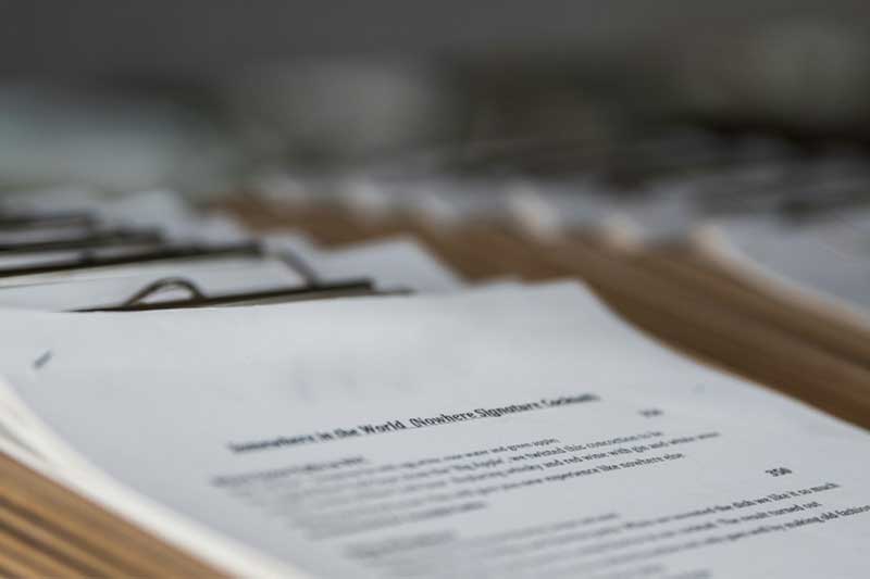 Stacks of paper clipped on clipboards. geoscientist