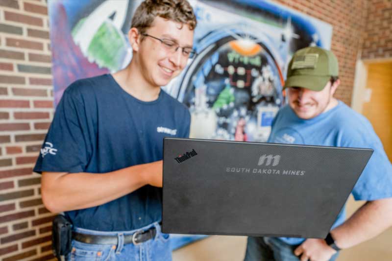 Student working on laptop.