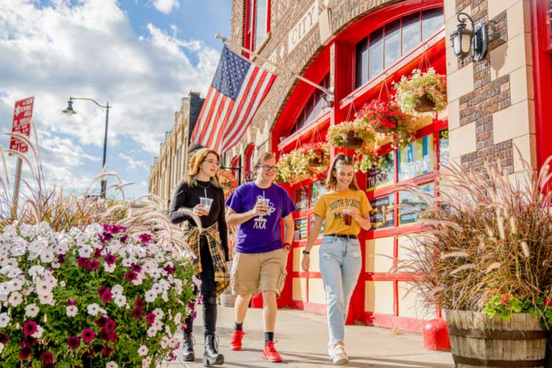 Group of students walking around downtown Rapid City.