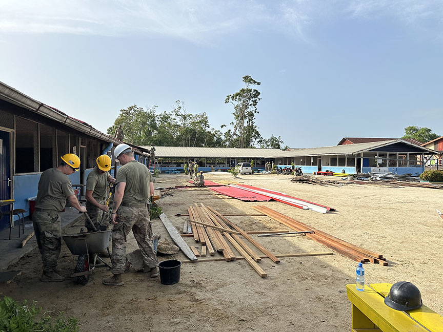 Soldiers with the South Dakota Army National Guard partnered with the Suriname military in a project to refurbish a school as part of their State Partnership Program. They replaced roofing, poured concrete for roof supports and replaced tree-filled gutters. 