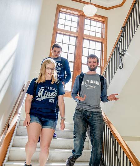 Students walking down stairs